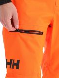 Thumbnail Helly Hansen, Sogn Cargo hardshell ski pants men neon orange 