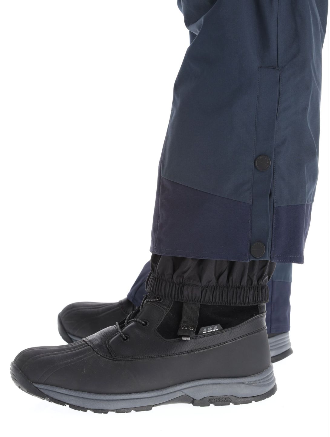 person grey jacket, black pants and blue snow boots free image